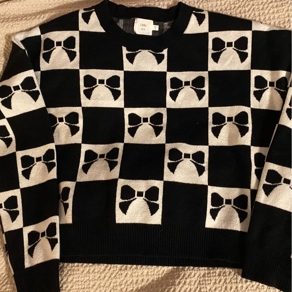 Chic Black and White Sweater with Bow Design